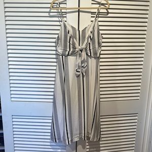 White midi dress with vertical stripes and open back. Never worn